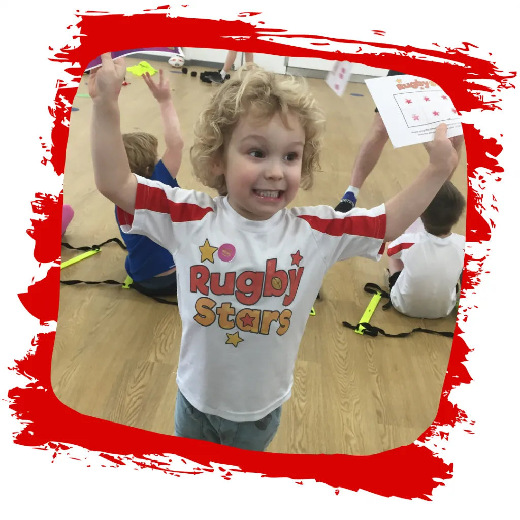 A happy child celebrating during a Minis session in Kibworth and Market Harborough